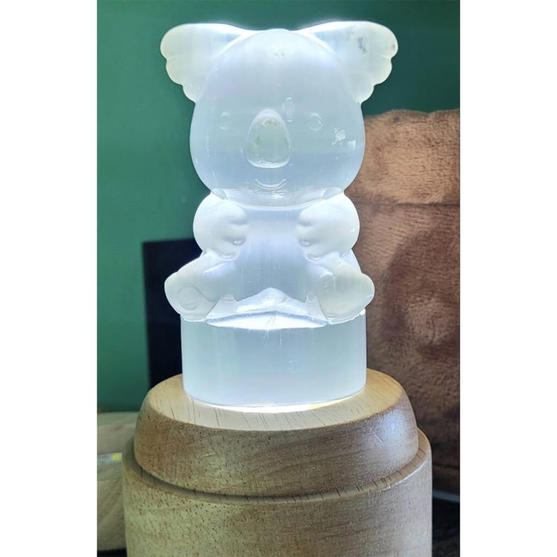 Selenite crystal bear on a light stand